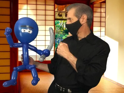Tony displaying a blue ninja balloon sculpture